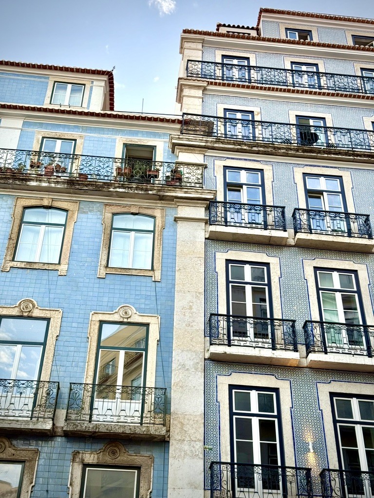 Blue and white building facades with balconies